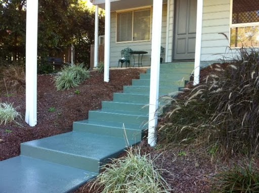 Front concrete steps and landing coated in a grey-green finish